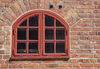 window with brick wall