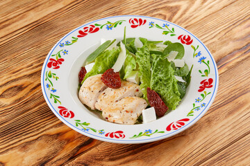 caesar salad on the wooden background