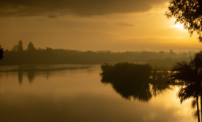 Misty winter dawn over water