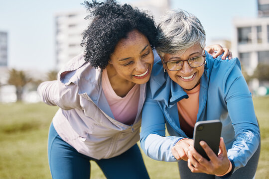 Senior woman, friends and outdoor with phone or social media, blog or reading post about workout, exercise and walk in park. Elderly person, people and check profile picture together on screen