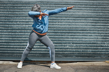 Woman, fitness and dab dance outdoor at training, exercise or workout achievement with celebration. Mature runner lady, comic dancing and winner in city with mindset, freedom or commitment to health