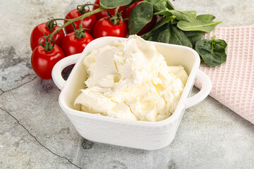 Soft cream cheese in the bowl