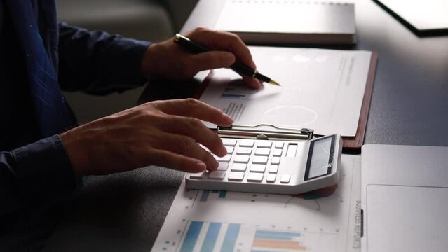 Company finance staff preparing financial documents, company finance staff preparing company finance documents to bring to the meeting to summarize for management's acknowledgment. Financial concept.