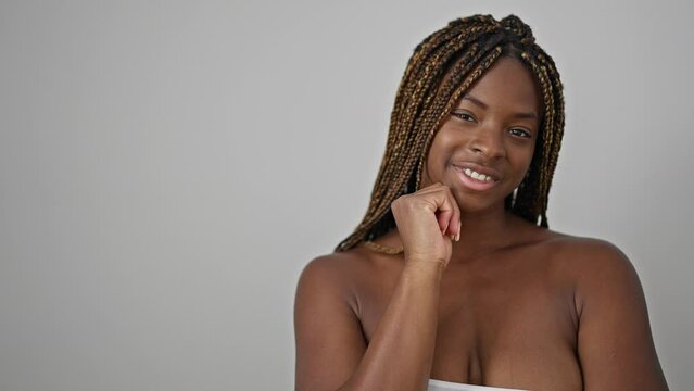 African american woman smiling confident touching face over isolated white background
