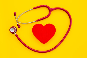 Medical stethoscope and red heart, top view. Health care and heart check concept