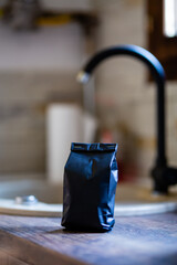 Fresh roasted coffee in a black bag