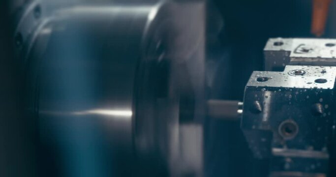 Working on an industrial machine cutting and sharpening and grinding on a machine