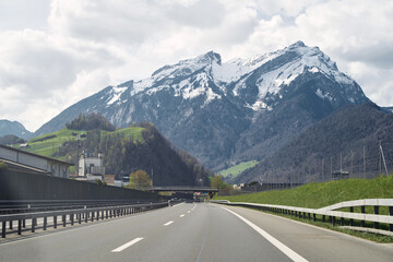 Scenic Mountain Road Landscape. A Stunning Highway Journey through Colorful Nature in Europe. Nature landscape on a beautiful highway. car driving on the highway in spring.