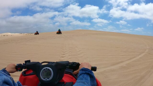 Quad biking at Lancelin Sand Dunes, Western Australia.