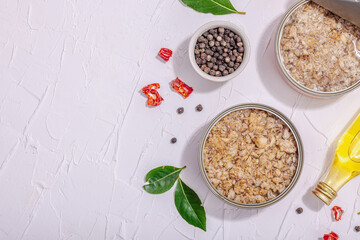 Tinned fish tuna in oil with spices and herbs. Healthy ingredient for vegetarian lifestyle. Seafood