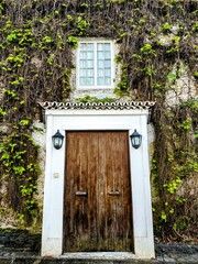 Beautiful old Door with Lanterns and Ivy