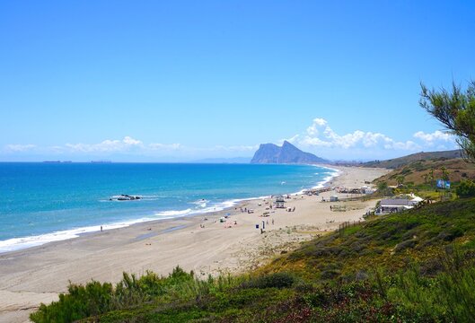 view along the beach near La Alcaidesa with a view towards the Rock of Gibraltar and La L&iacute;nea de la Concepci&oacute;n, Playa de la Hacienda, Mediterranean Sea, Andalusia, Malaga, Spain
