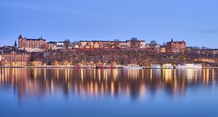 Fototapeta premium Idyllic scene of Sodermalm in Stockholm situated beside a tranquil lake in Sweden