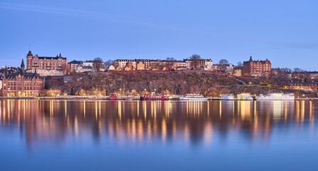 Idyllic scene of Sodermalm in Stockholm situated beside a tranquil lake in Sweden