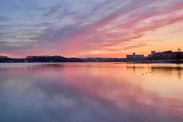 Foto auf Acrylglas Stockholm Idyllic scene of Stockholm cityscape on the shore at sunset in Sweden