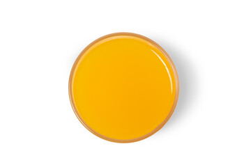 The orange water glass is captured from a high angle against a white background.