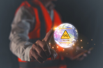 Hand holding virtual glob and caution sign CO2 reduce icon  concept of decrease carbon dioxide emission ,carbon footprint and carbon credit climate change, the elements of this image furnished by NASA