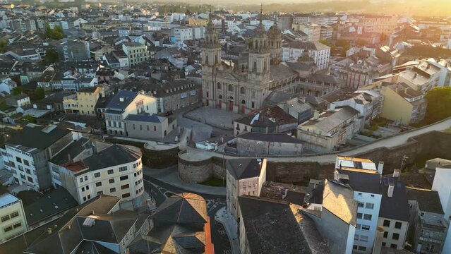 Aerial view of Lugo old town, Galicia, Spain. Flying around cathedral and old houses in Lugo at sunrise. On the path Camino Primitivo