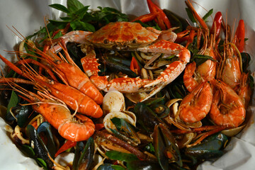 Seafood mixed on paper plate with top view