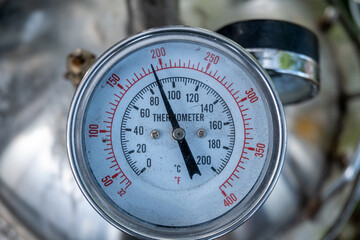 temperature gauge or thermometer on the distillation machine