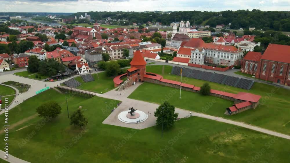 Wall mural Drone shot over Kaunas Castle with a town view and red houses