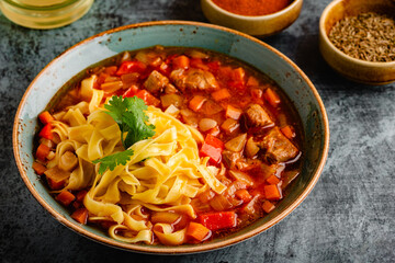 Lagman soup with lamb, homemade noodles and vegetables.