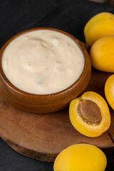 fresh yogurt with taste and chunks of yellow apricot