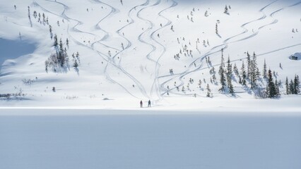 Vast expanse of a snow-covered field leading to the mountain with people climbing up