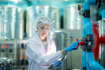 scientist worker checking the quality of Reverse osmosis machine system at the industrial factory....