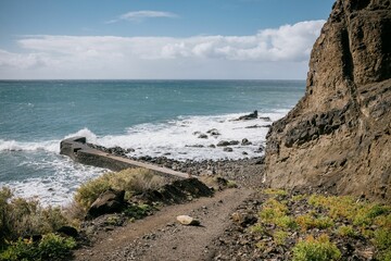 Fototapeta na wymiar Stunning landscape of a cliffside overlooking a body of water, La Gomera, Spain, Canary Islands