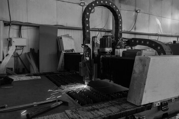 CNC Laser cutting of metal, modern industrial technology. Cutting of metal. Sparks fly from laser....