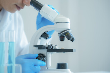 Scientist analyze biochemical samples in advanced scientific laboratory. Medical professional use microscope look microbiological developmental of viral. Biotechnology research in science lab.