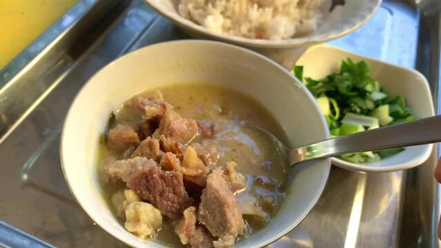 Coto Makassar or beef soup, traditional culinary from Makassar, South Sulawesi, Indonesia.