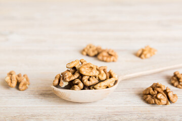Fresh healthy walnuts in bowl on colored table background. Top view Healthy eating bertholletia concept. Super foods