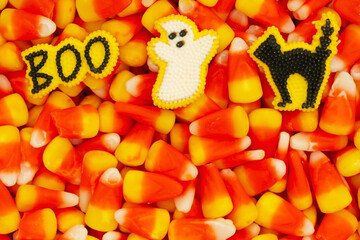 Candy corn, ghost, cat, and boo Halloween background