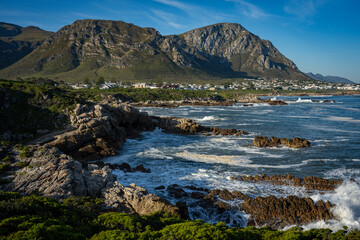 Fototapeta na wymiar The view from Sievers Point looking towards Kwaaiwater and the Kleinrivier mountains in the background. Hermanus, Whale Coast, Overberg, Western Cape, South Africa.