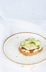 Vegan sandwich with cucumber and sun-dried tomato paste