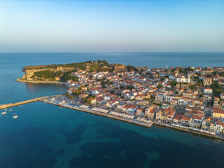 Naklejka premium Aerial view over Koroni seaside city at sunset. Koroni, Messenia, Greece
