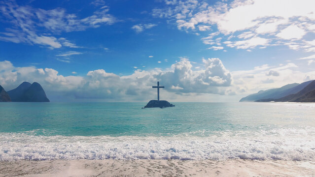 Christ Cross on an island in the middle of the open sea. Concept for faith, power, worship, Cristianity and Easter