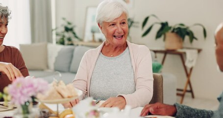 Talking, lunch and senior friends at a table for conversation, tea or retirement group together. Happy, dining room and a man speaking to elderly women during breakfast for communication and bonding