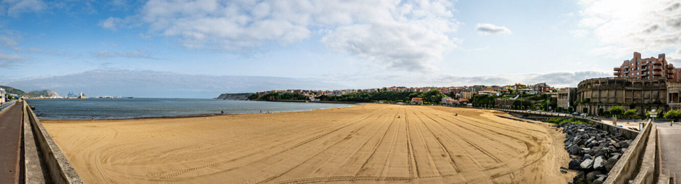 No people sunbathing on playa de ereaga groomed beach close to Bilbao, Spain's neighborhoods of Getxco and Neguri