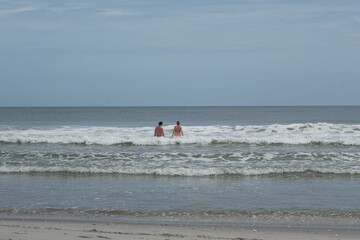 People swimming in the beautiful blue ocean of Myrtle Beach, South Carolina
