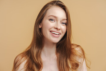 Fototapeta premium Close up portrait of beautiful smiling woman with toothy smile looking at camera