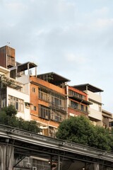Vertical shot of old brick buildings under a clear sky in Taiwan