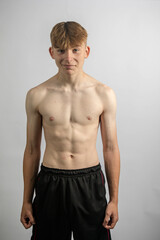 Portrait of a sporty shirtless teenage boy