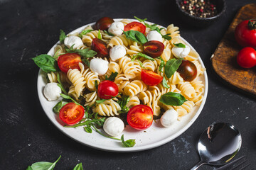 Pasta with mozzarella and tomatoes .Pasta caprese