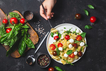 Pasta with mozzarella and tomatoes .Pasta caprese