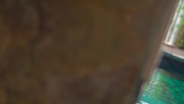 Slow-motion view of a small scupper waterfall