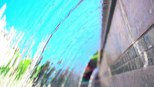 Slow-motion view of a scupper waterfall