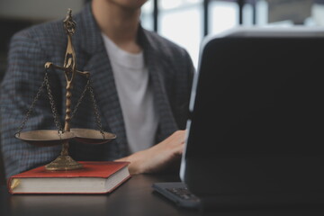 Business and lawyers discussing contract papers with brass scale on desk in office. Law, legal...